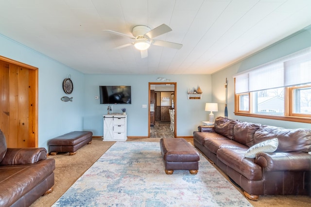 carpeted living room featuring ceiling fan