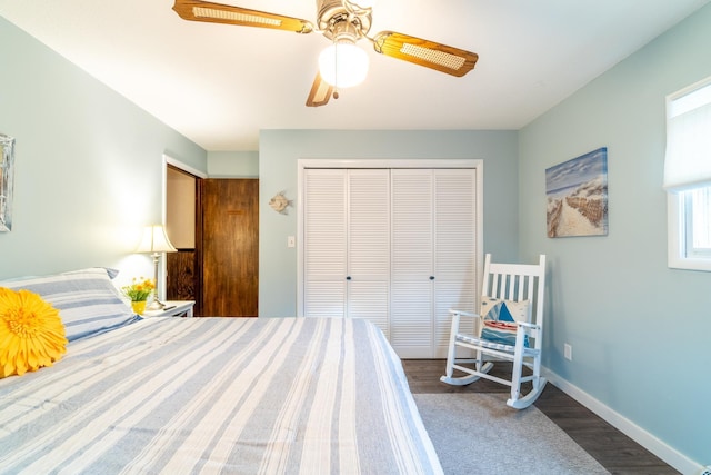 bedroom featuring hardwood / wood-style flooring, ceiling fan, and a closet