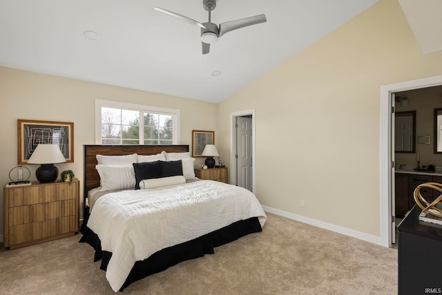 bedroom with ceiling fan, light colored carpet, and lofted ceiling