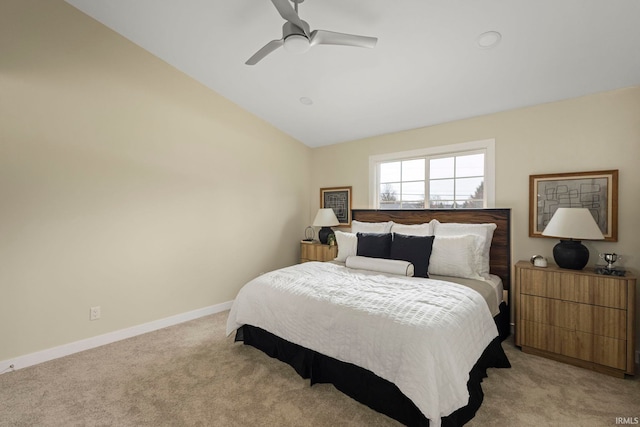 bedroom featuring lofted ceiling, light colored carpet, and ceiling fan