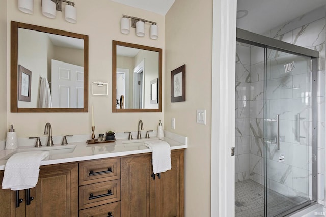 bathroom featuring vanity and an enclosed shower