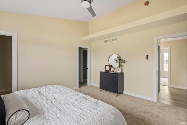 carpeted bedroom with lofted ceiling and ceiling fan