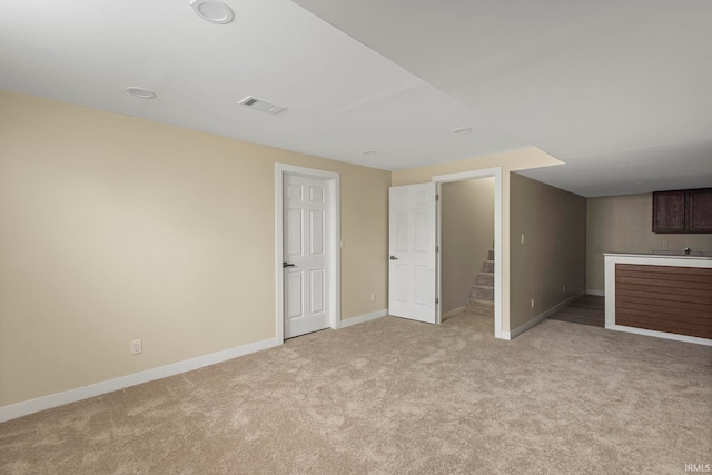 interior space featuring light colored carpet