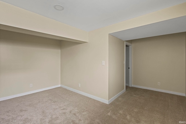 basement featuring light carpet