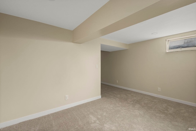 basement featuring light colored carpet