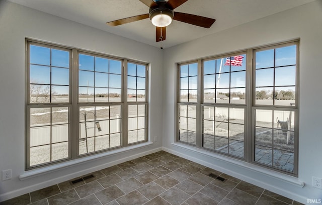 interior space featuring ceiling fan