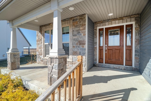 property entrance featuring a porch