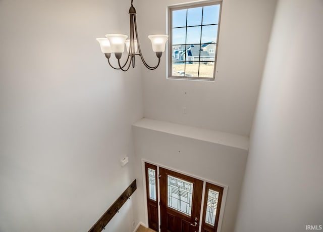 foyer entrance featuring a chandelier