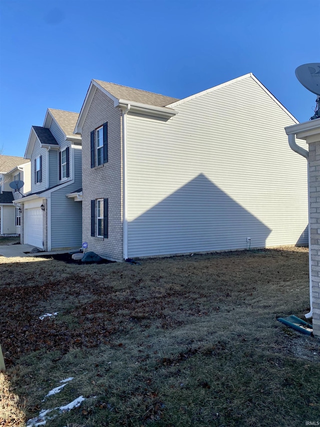 view of property exterior with a garage