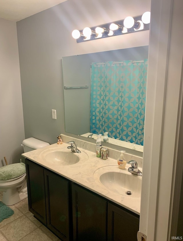 bathroom featuring vanity, a shower with curtain, tile patterned floors, and toilet