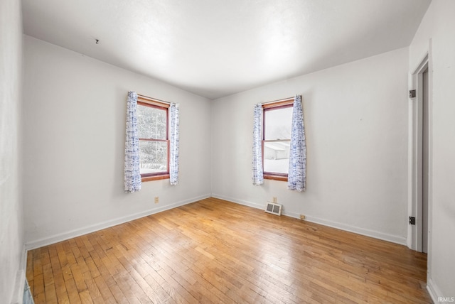 empty room featuring wood-type flooring