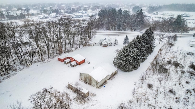 snowy aerial view featuring a rural view