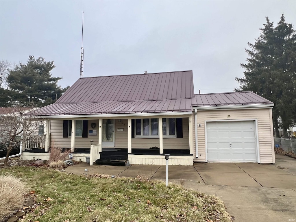 view of front of home with a garage and covered porch