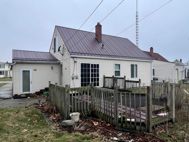 rear view of property with a deck