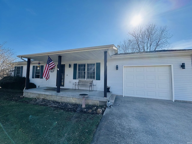 single story home with a garage and covered porch