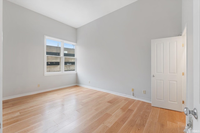 spare room with light wood-type flooring