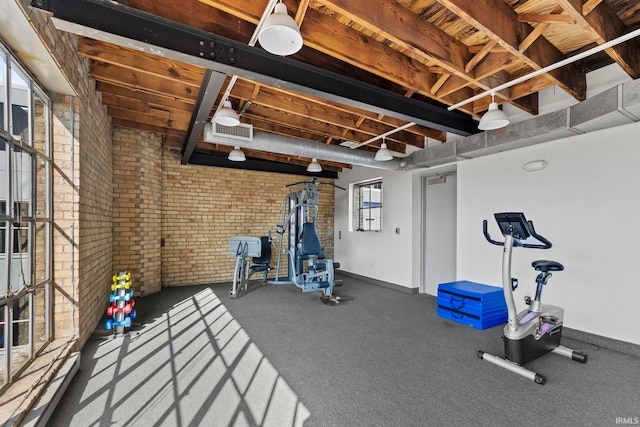 workout area with brick wall