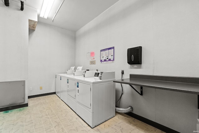 laundry room with washing machine and clothes dryer