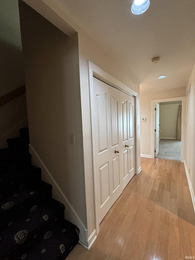 corridor featuring light hardwood / wood-style floors