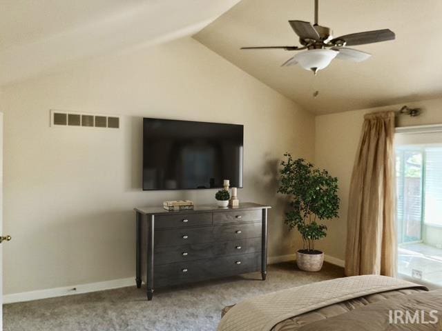 unfurnished bedroom featuring light carpet, vaulted ceiling, and ceiling fan