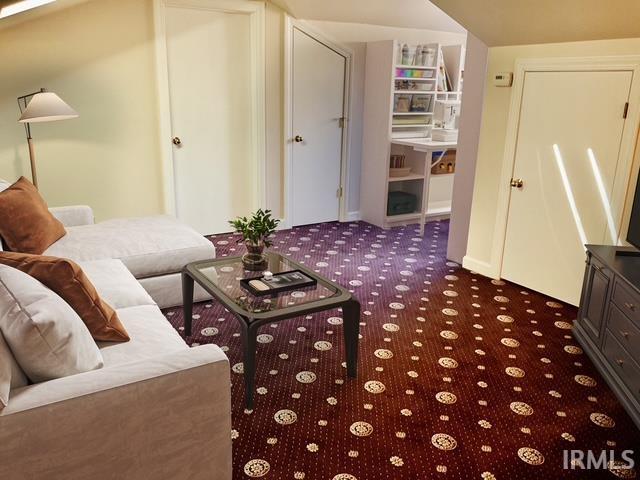 living room featuring dark colored carpet