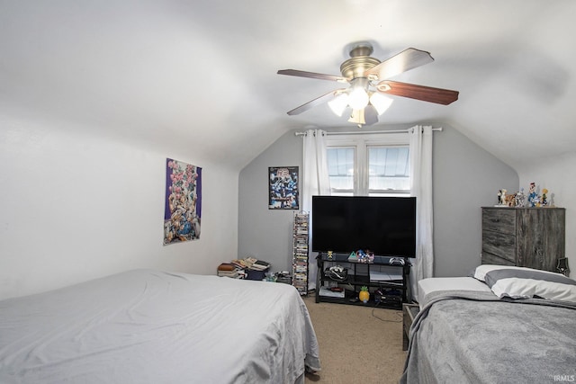 bedroom featuring vaulted ceiling, ceiling fan, and carpet flooring