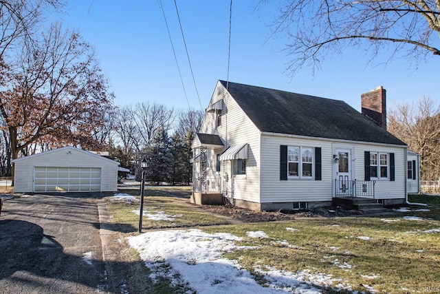 view of front of house with a garage and an outdoor structure