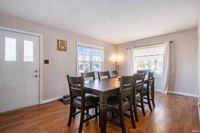 dining space featuring dark hardwood / wood-style flooring