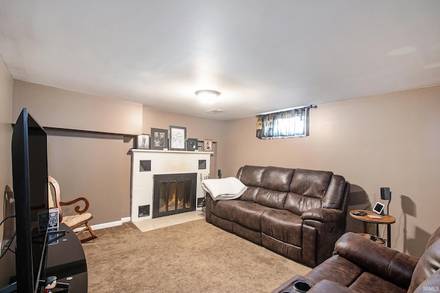 carpeted living room featuring a brick fireplace