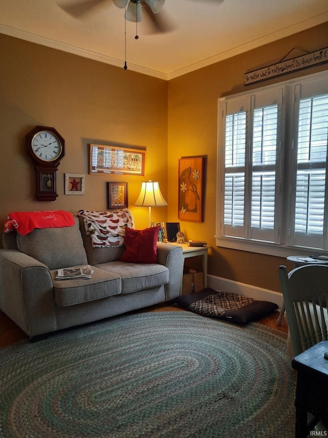 living room featuring ceiling fan, a healthy amount of sunlight, and ornamental molding