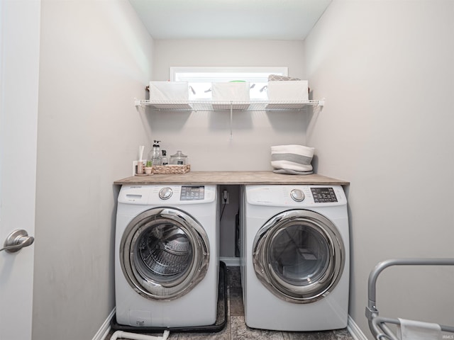 clothes washing area with washing machine and clothes dryer