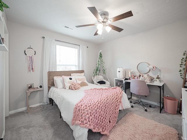 bedroom featuring ceiling fan and light carpet