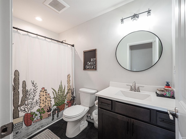 bathroom featuring tile patterned floors, vanity, and toilet