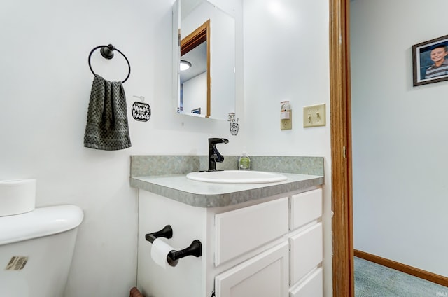 bathroom with vanity and toilet