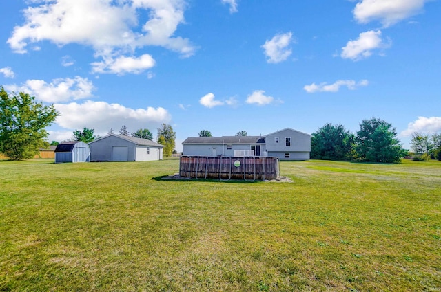 view of yard featuring a pool and a shed