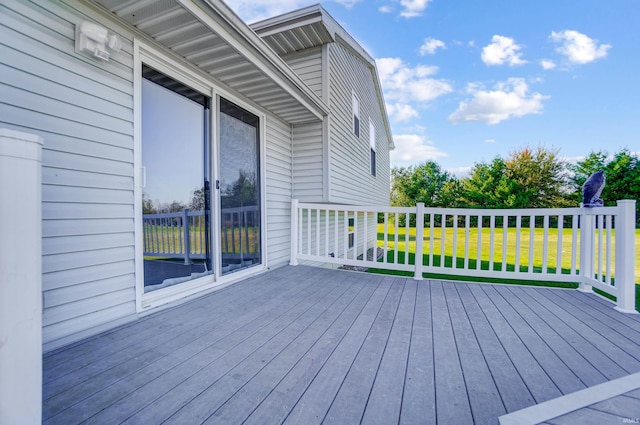 wooden deck with a yard