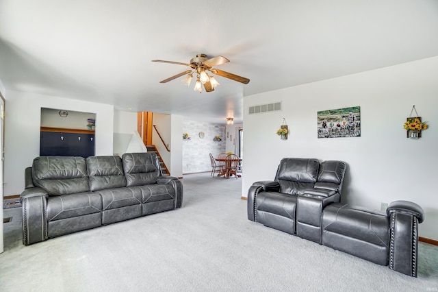 carpeted living room featuring ceiling fan