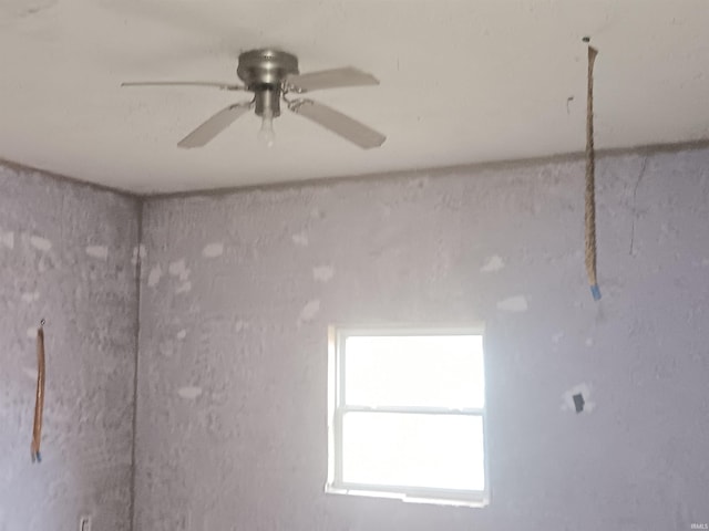 unfurnished room with ceiling fan