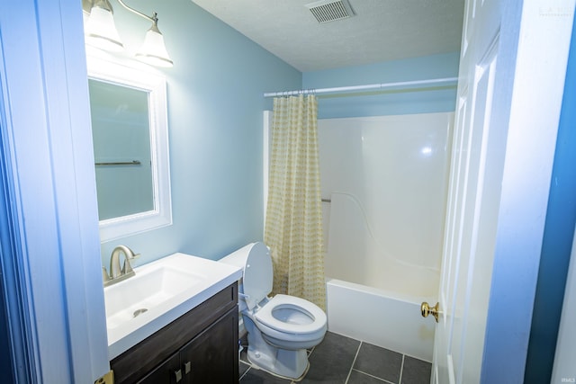 full bathroom with tile patterned flooring, vanity, shower / bath combination with curtain, a textured ceiling, and toilet