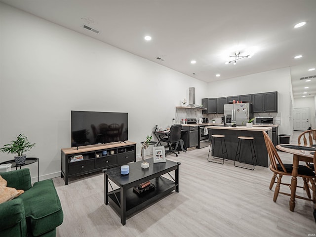 living room with light hardwood / wood-style floors