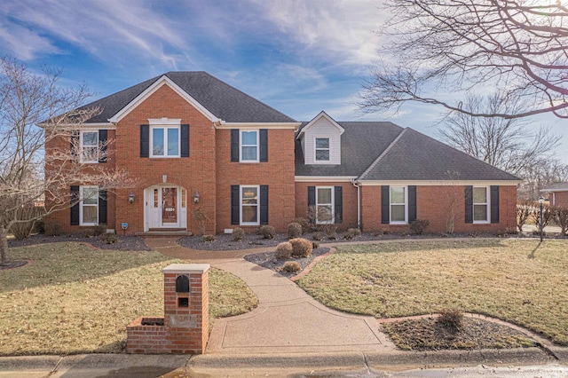 colonial-style house with a front yard