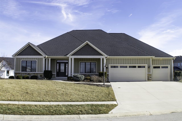 view of front of house featuring a garage and a front yard