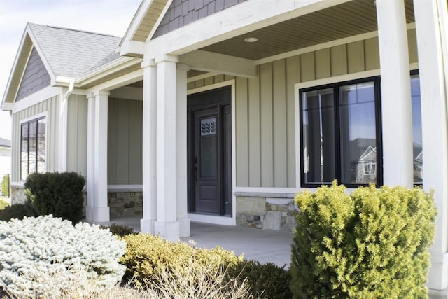 view of exterior entry with covered porch