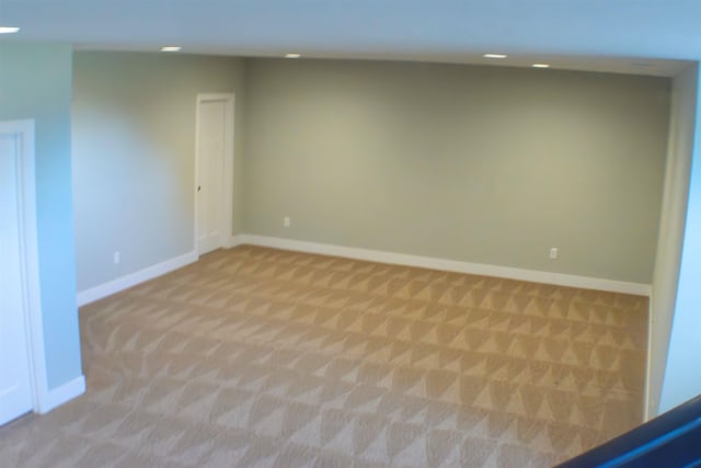 empty room featuring light colored carpet