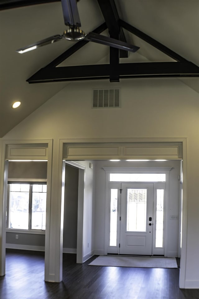 entrance foyer with dark wood-type flooring and lofted ceiling with beams