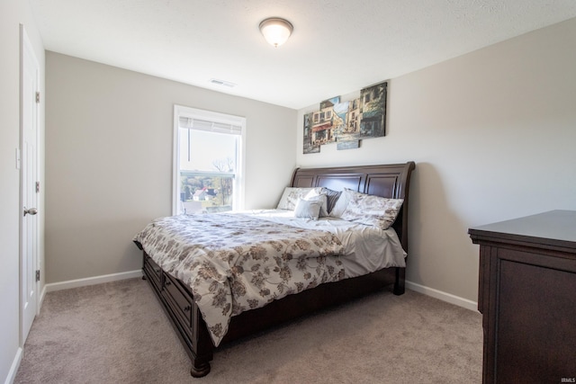 bedroom featuring light colored carpet