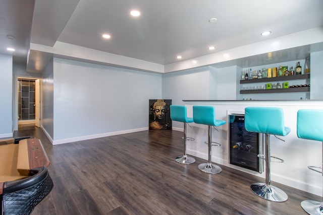 bar featuring dark hardwood / wood-style flooring