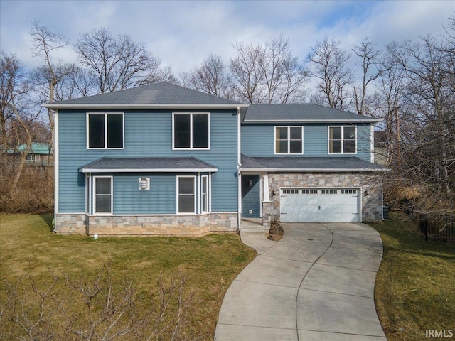 view of front of property with a garage and a front lawn