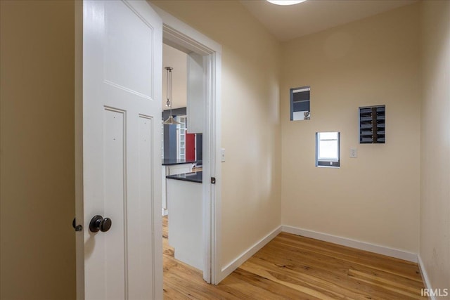 hall with light hardwood / wood-style floors