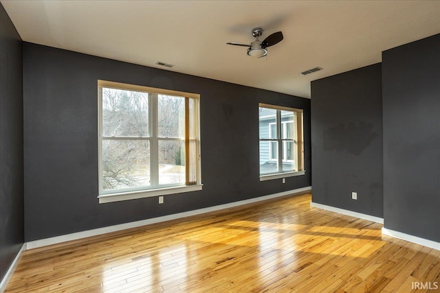 spare room featuring ceiling fan and light wood-type flooring